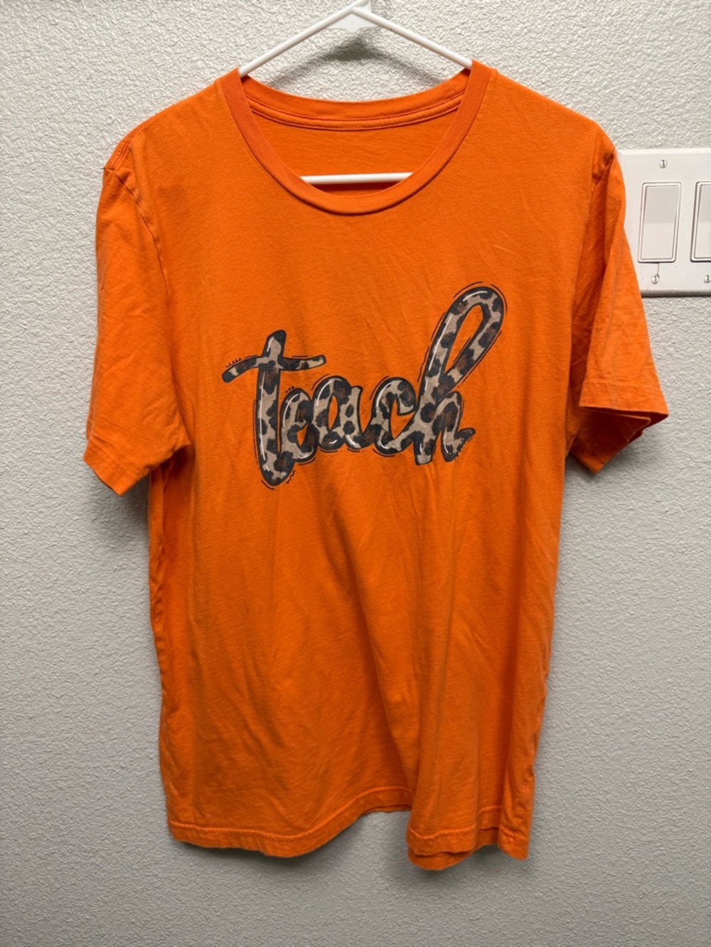 Orange Tee with Leopard 'teach' Script